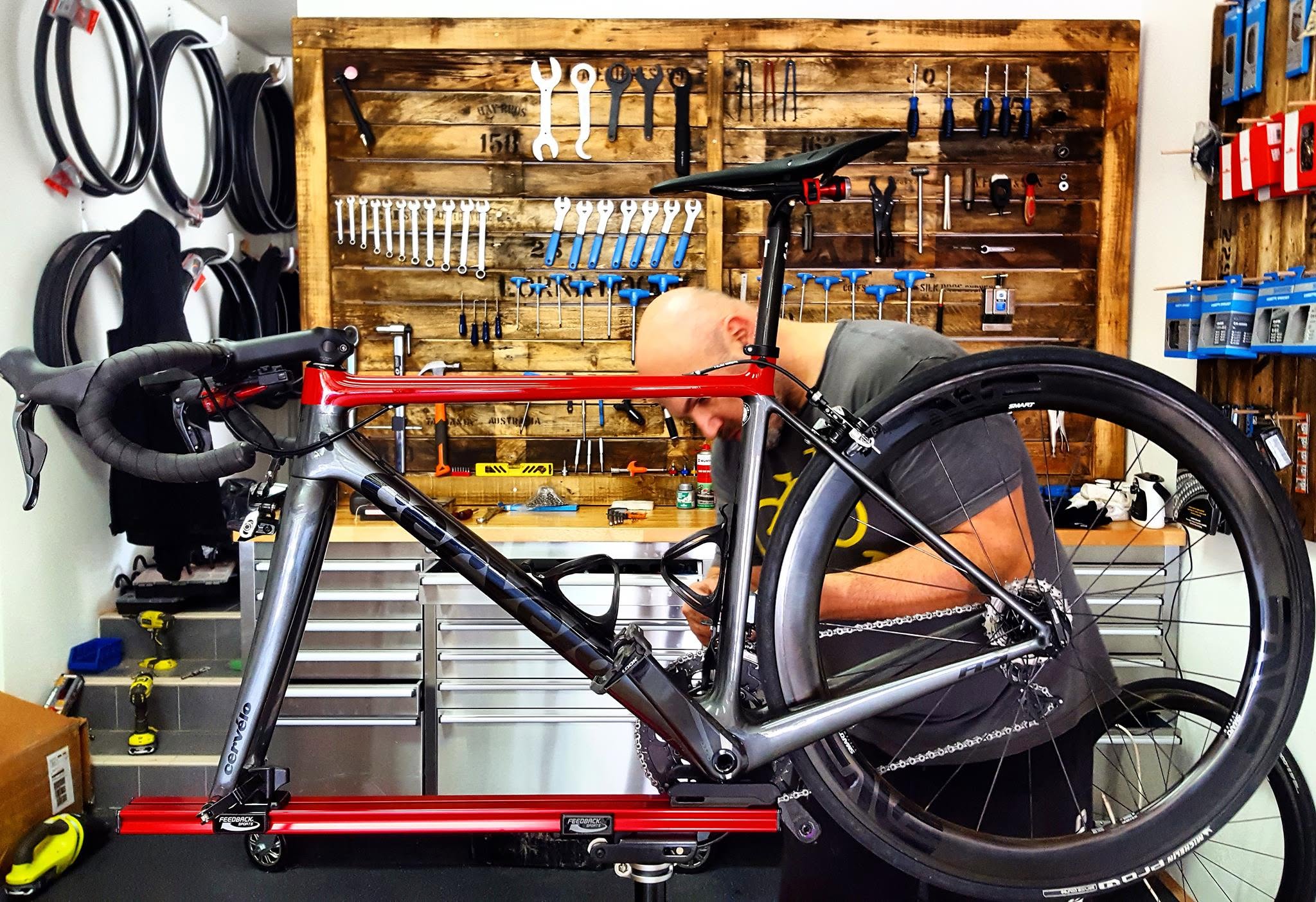 A mechanic working on a bike at the stand in the Vanilla Cycles workshop